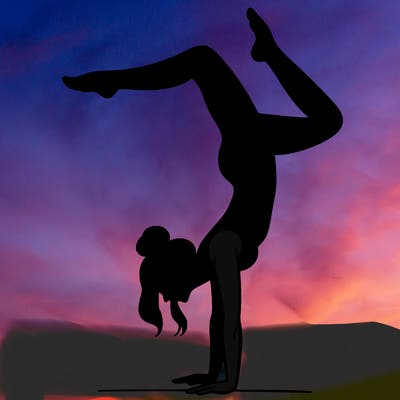 a woman doing a handstand