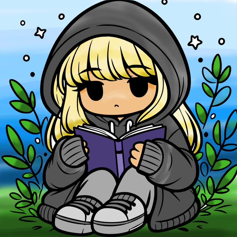 girl in oversized hoodie reading a book