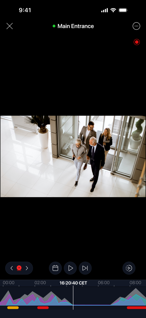 Alta Video - Live security camera feed of an office lobby entrance on the Alta Video app interface.