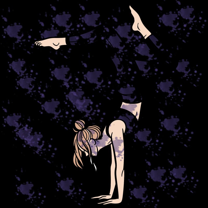 a woman doing a handstand