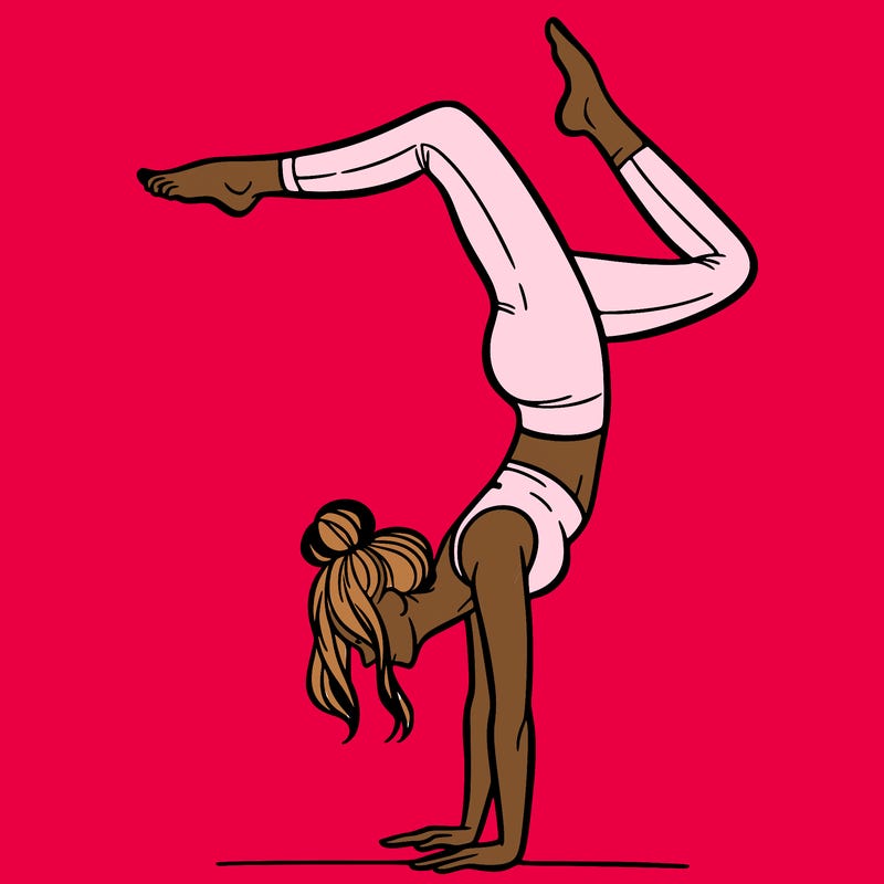 a woman doing a handstand