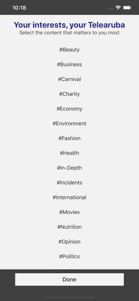Interest selection screen in the Telearuba app with a list of news categories like Business, Carnival, and Politics.