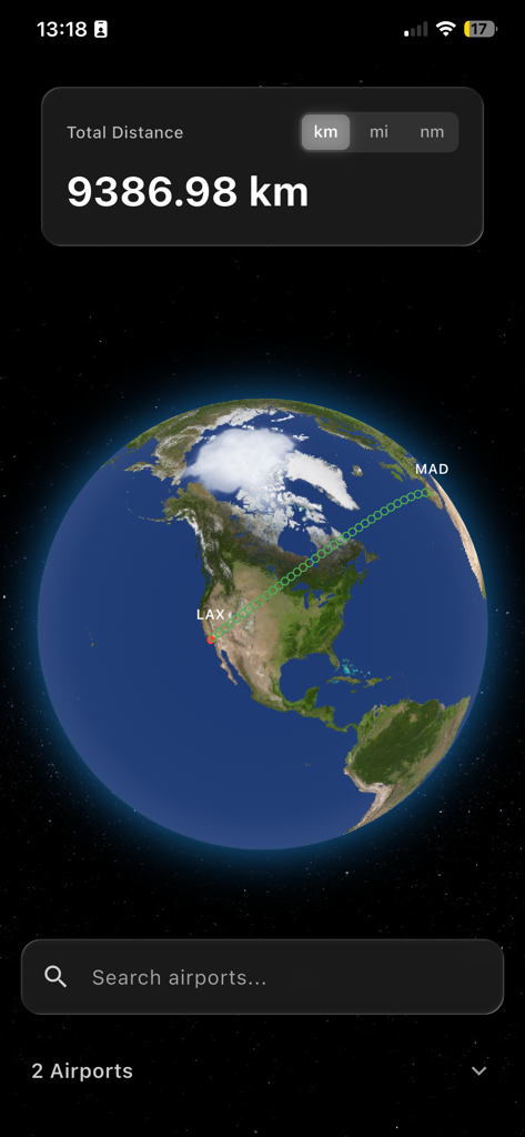 Una visualizzazione di un globo 3D che mostra il percorso e la distanza del volo tra gli aeroporti di LAX e MAD.