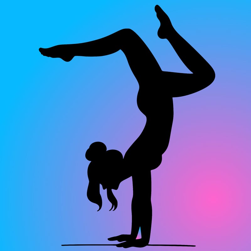 a woman doing a handstand