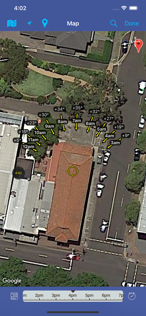 Satellite map view in Moon Seeker app showing the hourly lunar path and elevation angles over a building