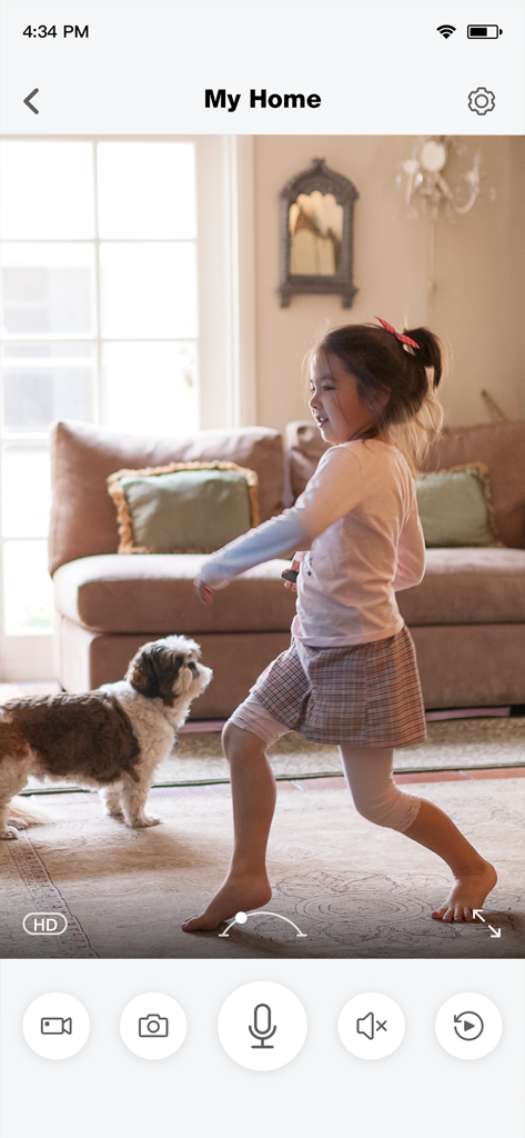 meShare app live HD camera feed of a girl and dog in a living room with remote monitoring controls