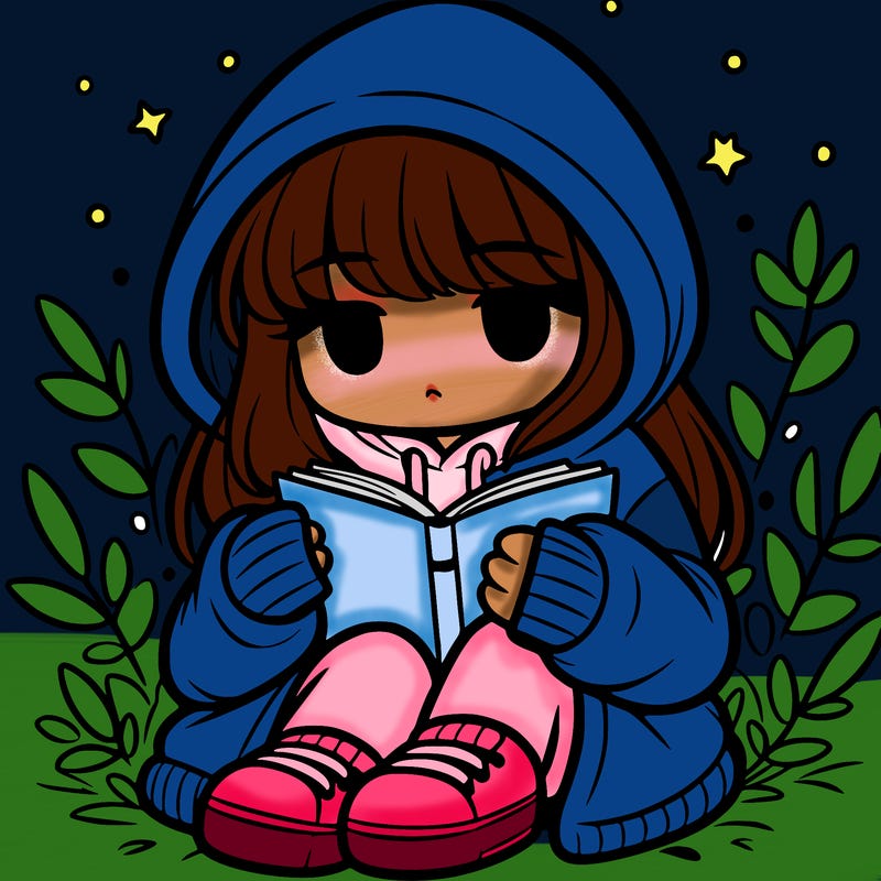 girl in oversized hoodie reading a book