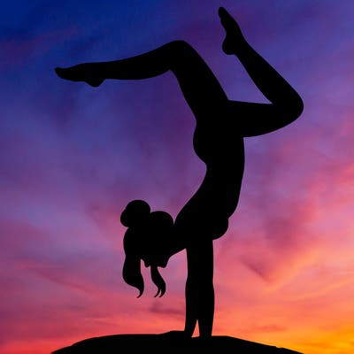 a woman doing a handstand