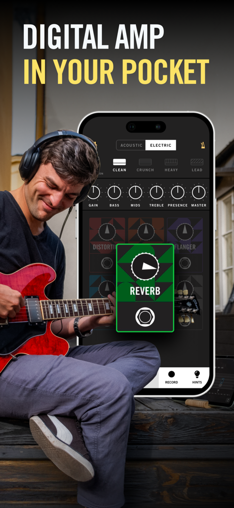 A man playing an electric guitar with headphones using the Gibson app digital amplifier interface on a smartphone