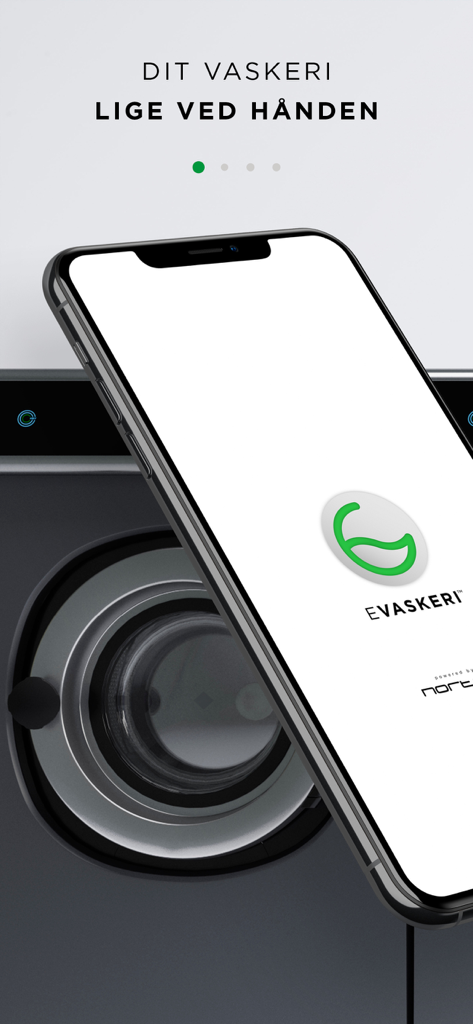 e-vaskeri - 洗濯機を背景にe-vaskeriアプリのロゴが表示されたスマートフォン
