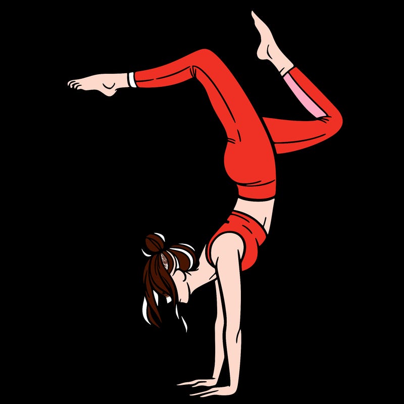 a woman doing a handstand