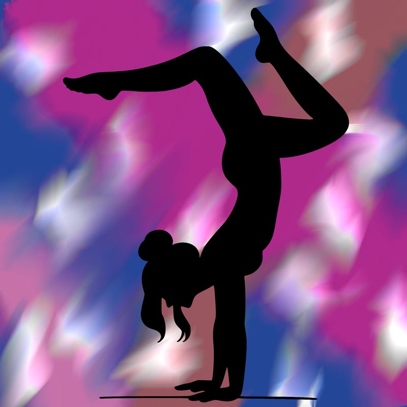 a woman doing a handstand