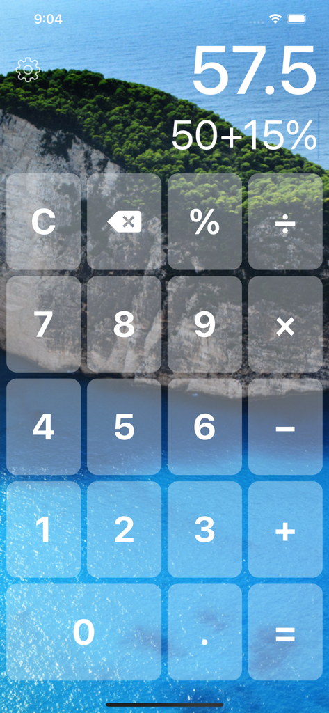 Big Button Calculator Pro Lite - Big Button Calculator interface with large transparent buttons over a scenic cliff and ocean background