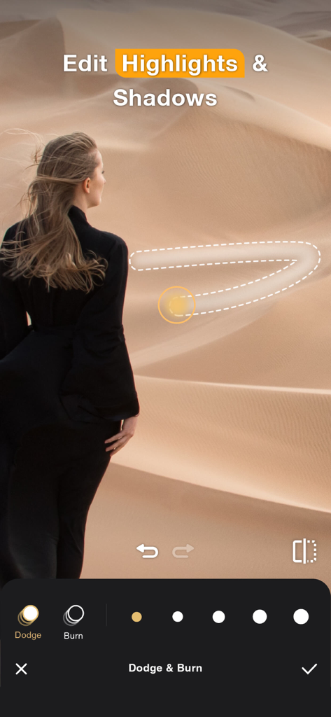 Perfect365 Studio AI | Images - A user adjusting highlights and shadows on a photo of a woman in a desert using the Dodge and Burn tool