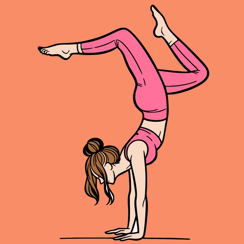 a woman doing a handstand