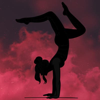 a woman doing a handstand