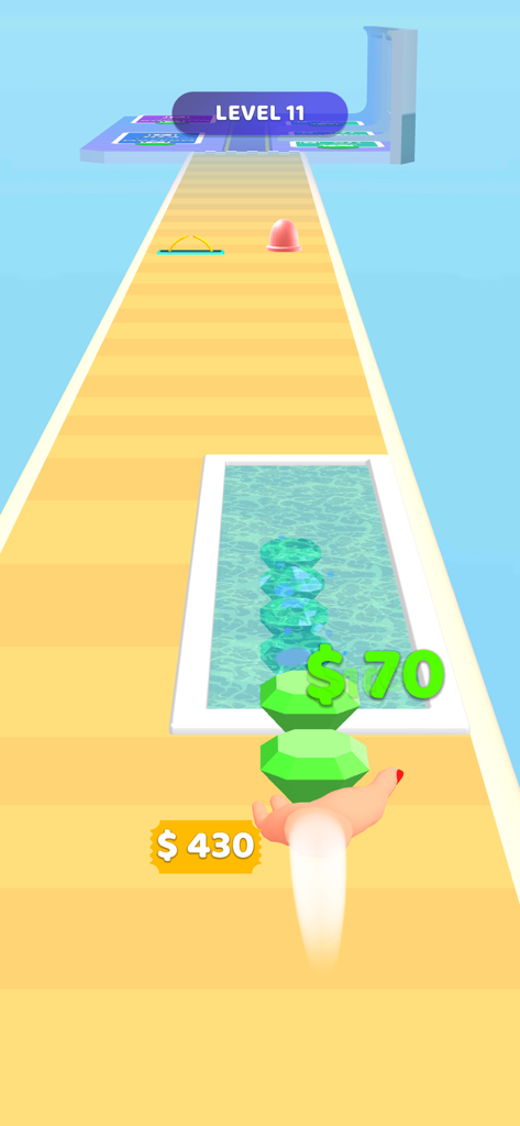 Gem Stack - A hand carrying a stack of green gems on a yellow runway in the Gem Stack mobile game