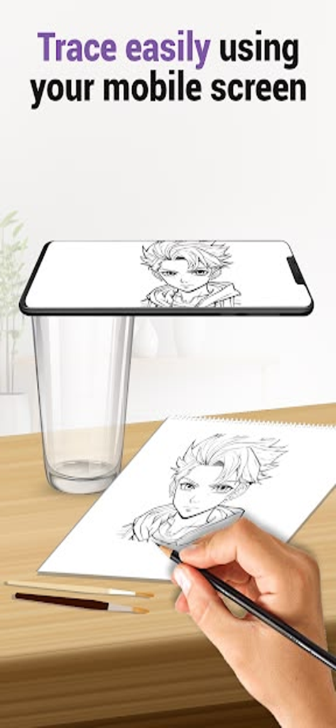 AR Drawing _ Draw Sketch App - Une personne traçant un personnage d'anime à partir d'un écran de téléphone portable sur du papier à l'aide d'un verre comme support