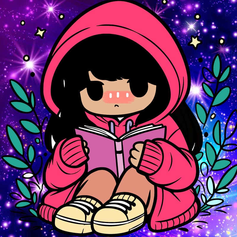 girl in oversized hoodie reading a book