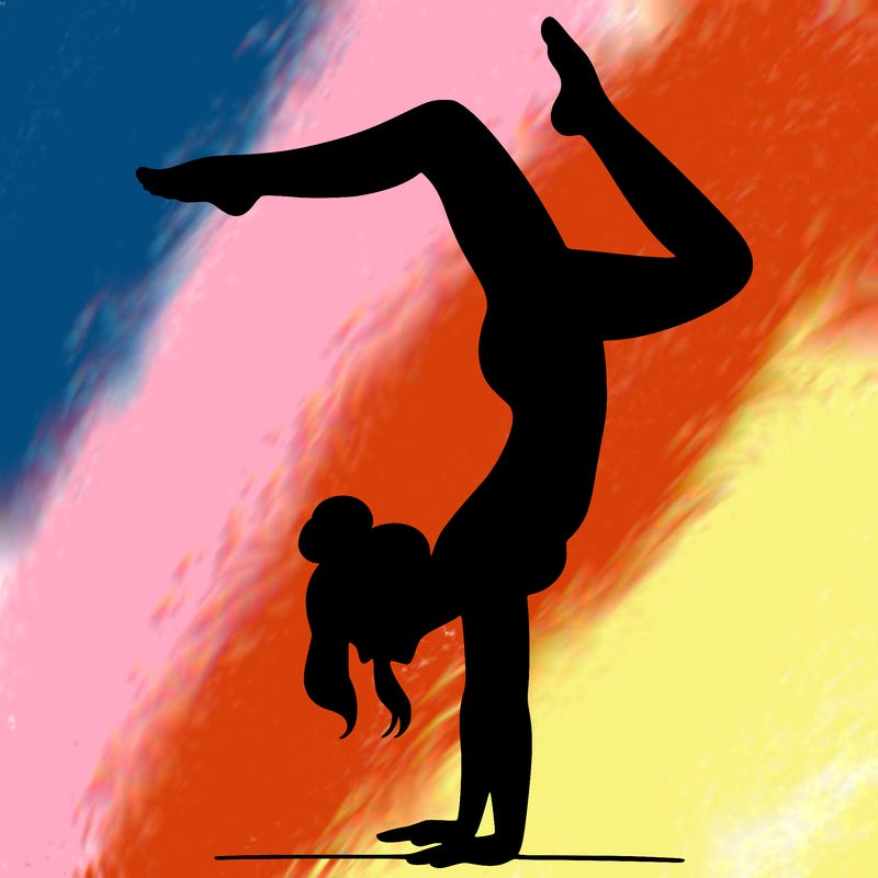 a woman doing a handstand