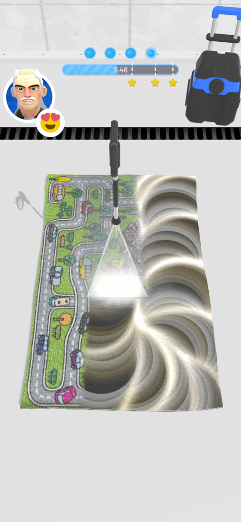 Gameplay of Clean My Carpet showing a pressure washer cleaning a dirty road map rug.
