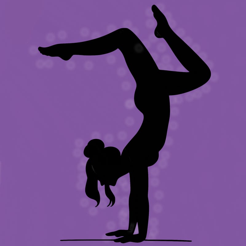 a woman doing a handstand