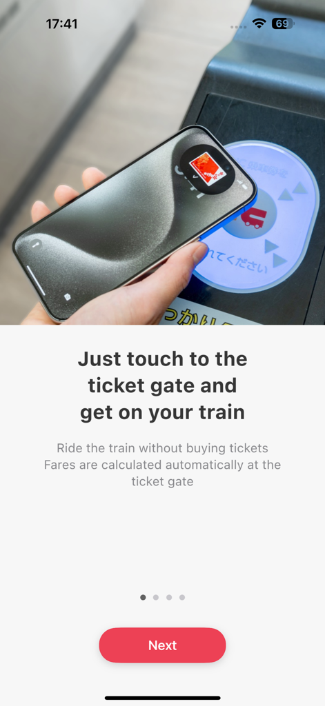 Welcome Suica Mobile - A person using an iPhone to tap a contactless ticket gate for a train in Japan using the Welcome Suica Mobile app