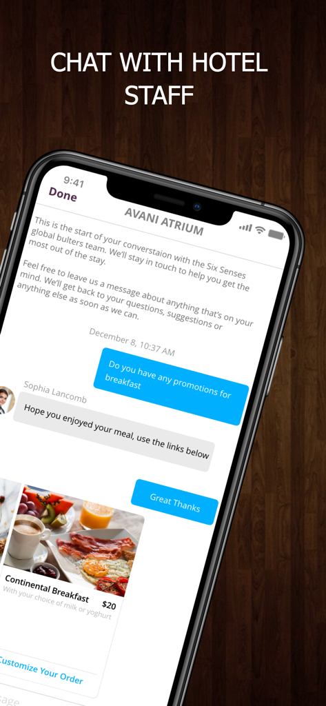 A smartphone screen showing the OKKAMI app chat interface where a guest communicates with hotel staff about breakfast promotions.