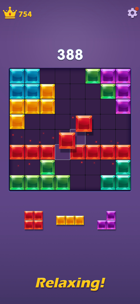 Gameplay screen of Block Puzzle Gem Blast with colorful jewel blocks and the word Relaxing.
