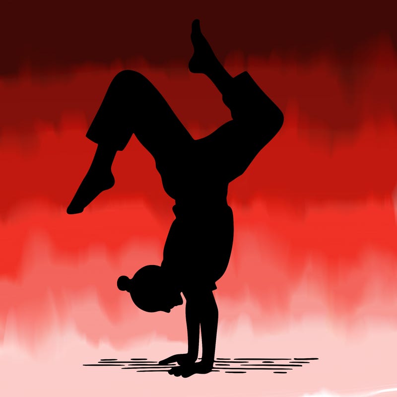 a woman doing a handstand