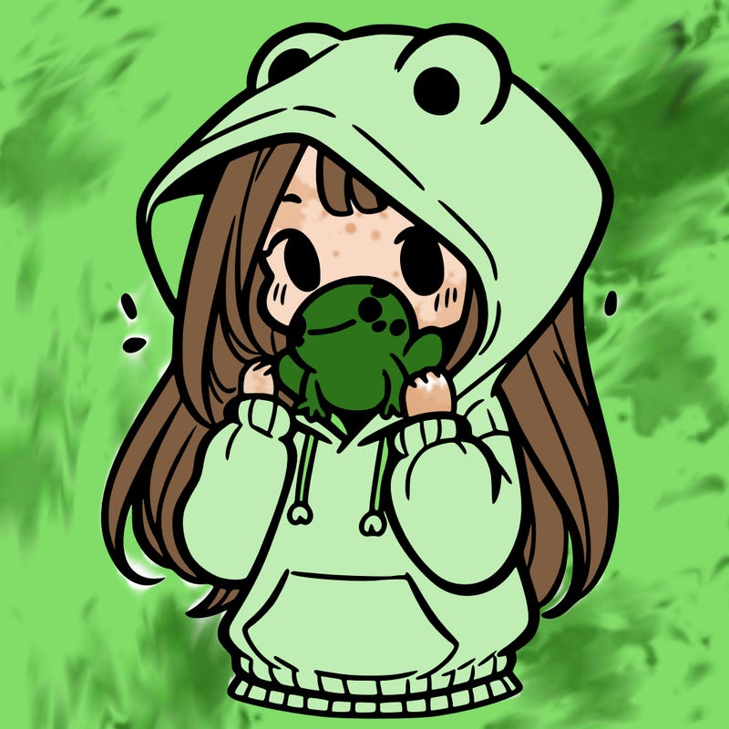a girl holding a froggy hoodie