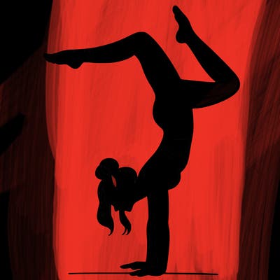 a woman doing a handstand