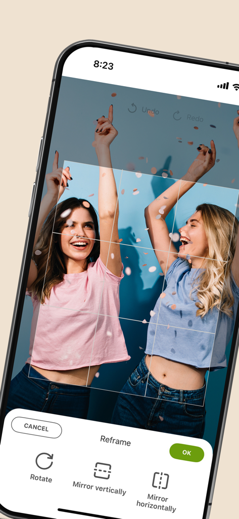 Saal Digital - Mobile app interface showing photo reframing and editing tools for a picture of two women