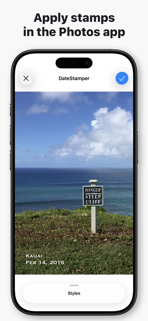 DateStamper app interface on iPhone showing a date and location stamp applied to a photo of a coastal cliff