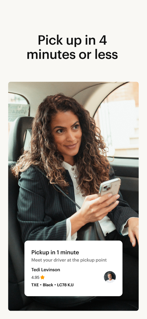 A business traveler in a London black cab viewing a fast pickup notification on the Gett app