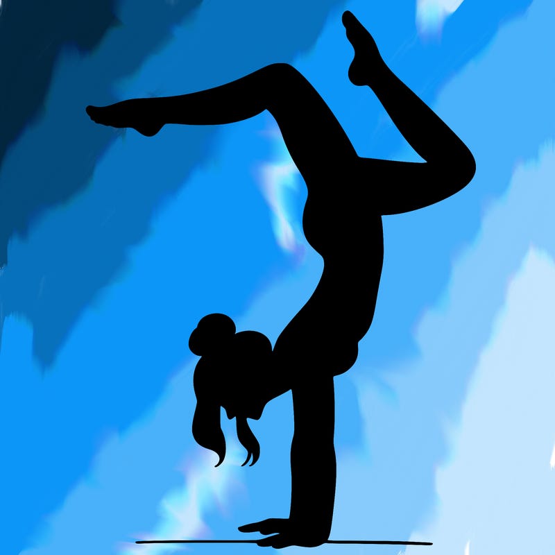 a woman doing a handstand