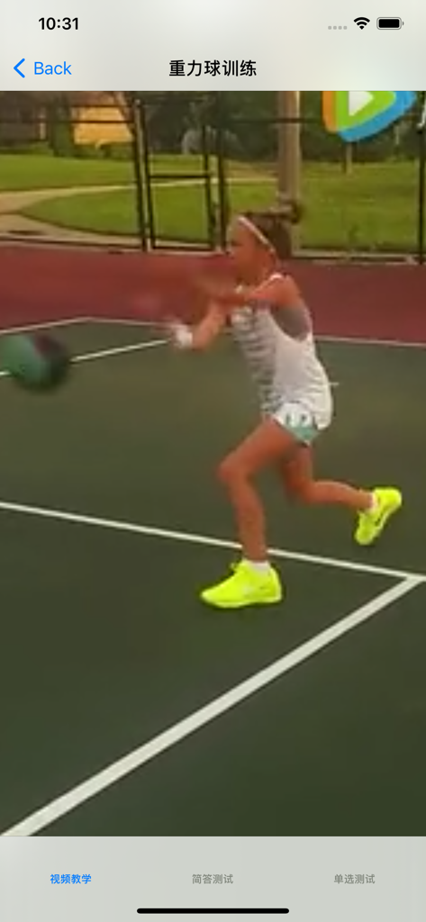A young girl performing medicine ball drills on a tennis court in a video tutorial.