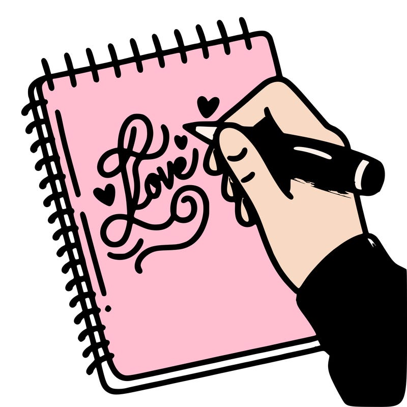 a hand writing “love” in calligraphy on a notebook