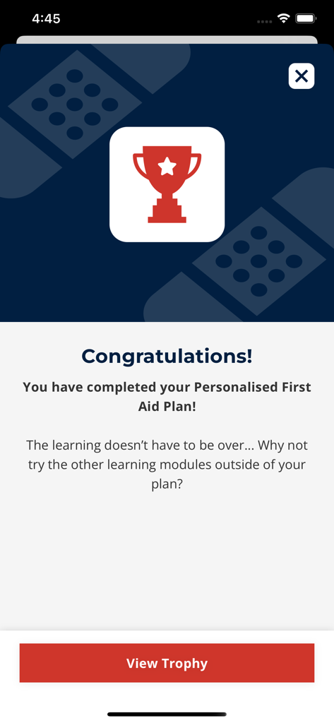 Congratulations screen in the IFRC First Aid app showing a trophy icon for completing a personalized first aid plan.