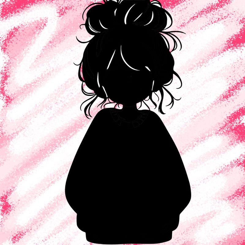 girl with baggy sweatshirt and messy bun