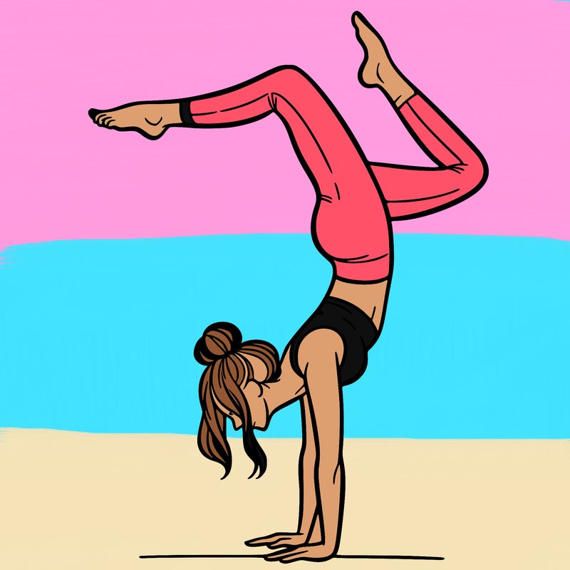 a woman doing a handstand