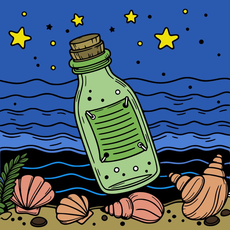 bottle with message on seaside sea shells around