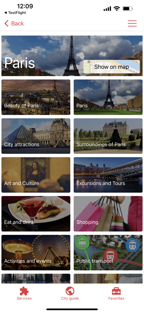 myguide.city - city guide - Écran du guide de la ville de Paris affichant des catégories de voyage comme attractions, restaurants, shopping et transports publics
