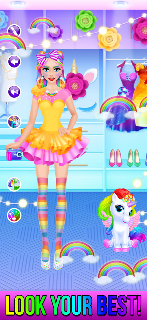 Rainbow Unicorn Candy Salon - Ein Mädchen mit regenbogenfarbenem Haar und Kleid posiert mit einem kleinen Baby-Einhorn in einem farbenfrohen Mode-Salon