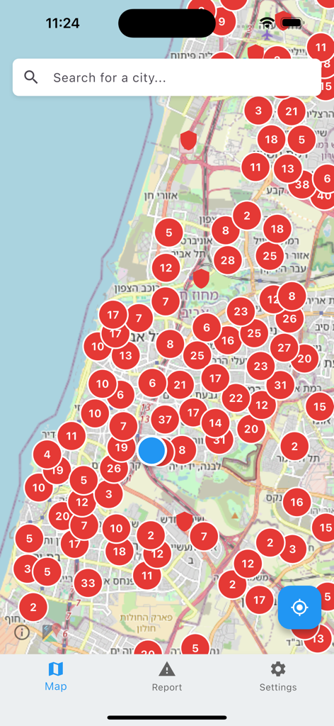 Mobile app interface displaying a map of Israel with numerous red markers indicating bomb shelter locations