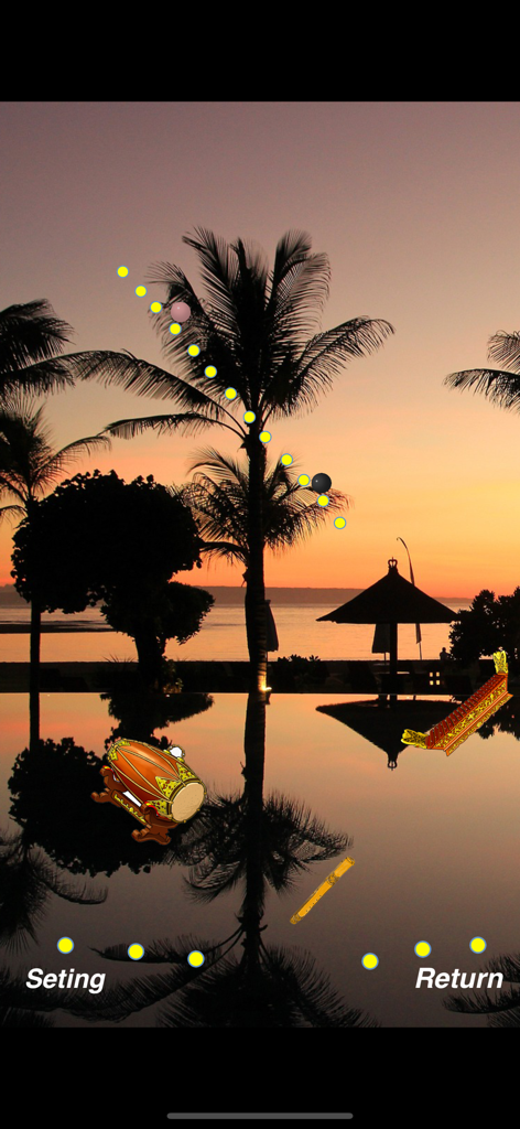 Auto Compose Music Box app screen showing yellow balls falling onto Gamelan instruments during a sunset