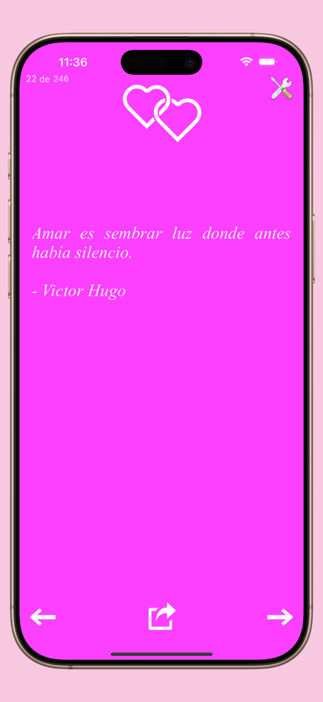 Frases de amor. - Frases de amorアプリのインターフェース。ピンクの背景にハートのアイコンが付いたビクトル・ユーゴーによるスペイン語のロマンチックな引用が表示されています。