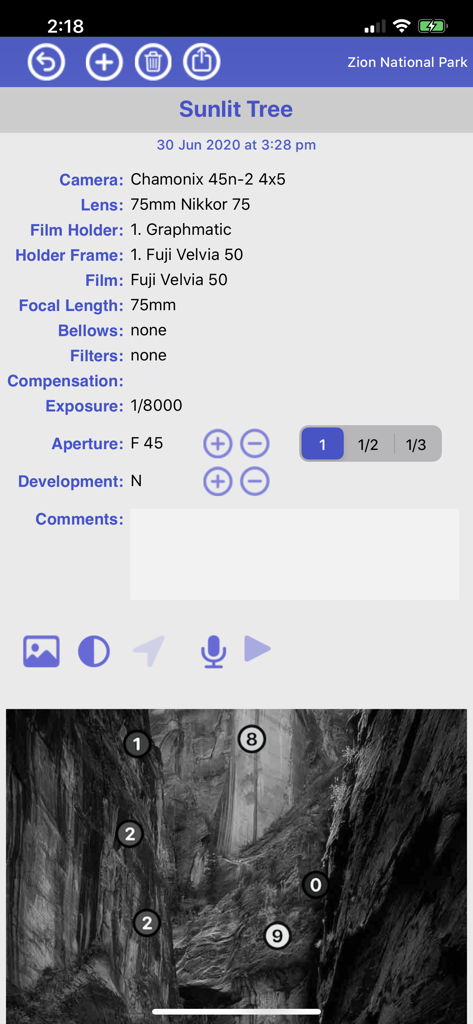 Technical details log for film photography in Reciprocity Timer app showing camera settings and Zone System mapping on a landscape image