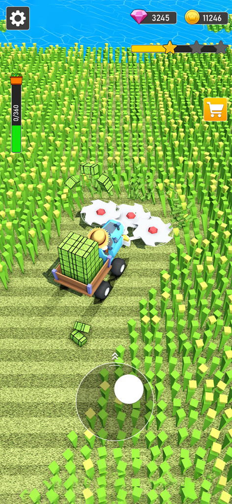 A blue tractor harvesting green grass in a field