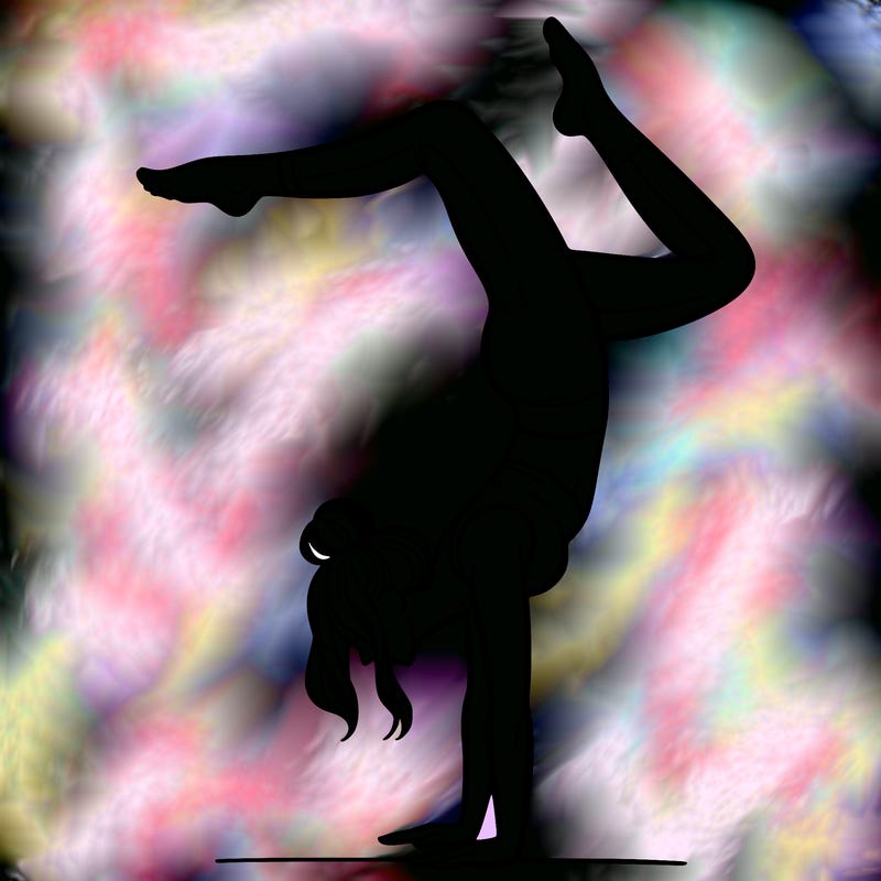 a woman doing a handstand